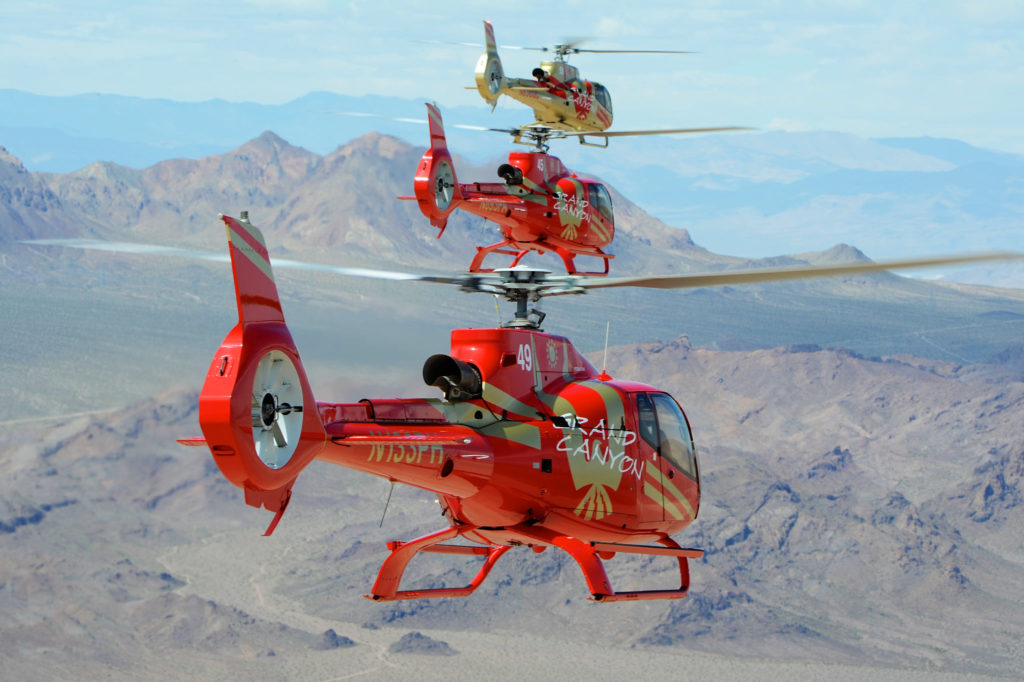 Papillon's red helicopters join the exclusive gold helicopter. - photo credit: Mike Reyno Pic