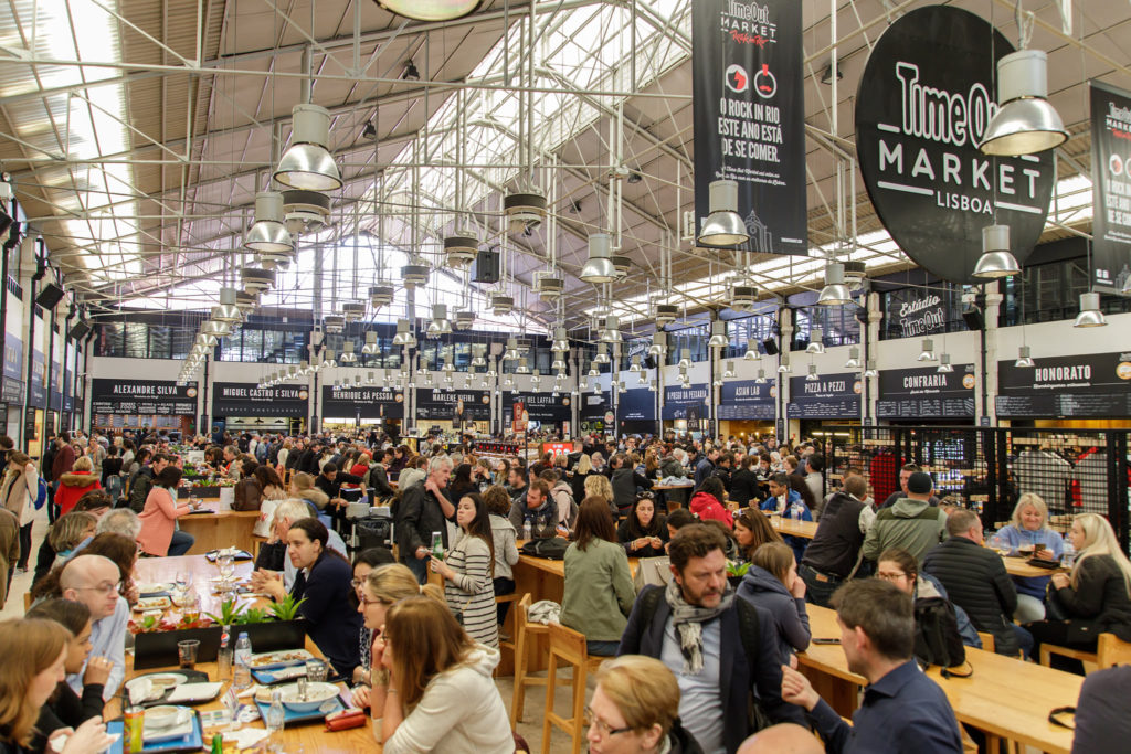 Tourist in the food hall of the Time Out Market in Lisbon, located in the Cais do Sodré